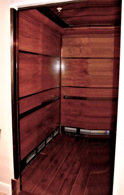 After: elevator interior after cleaning and refinishing